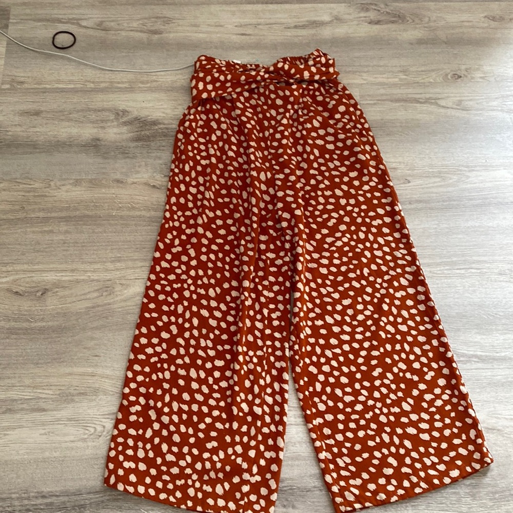 White dotted flair pants